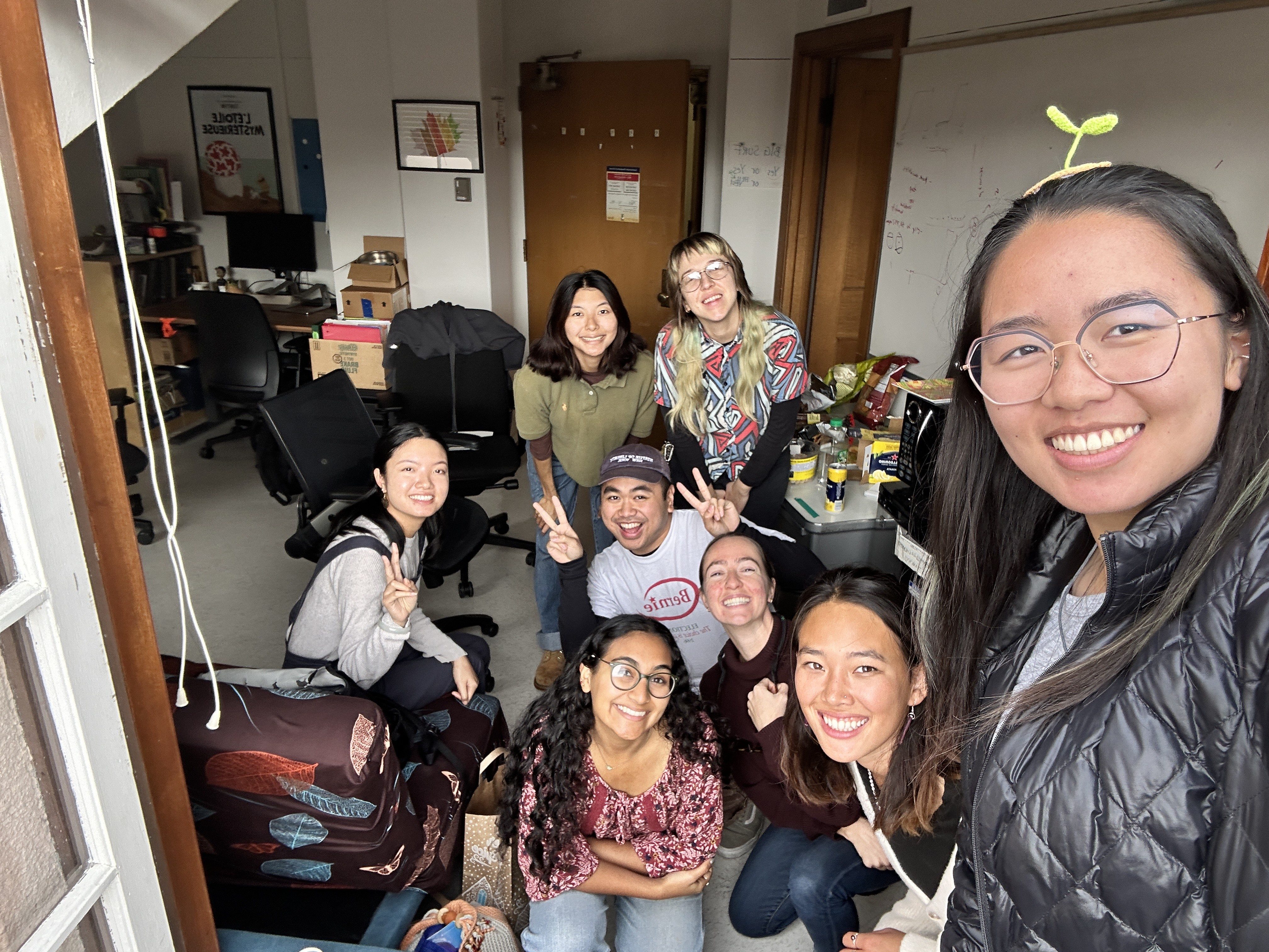 Students smiling in the lab at a social event